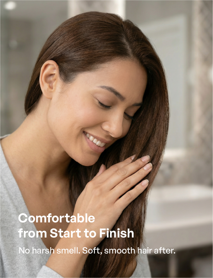 A woman enjoying the fresh scent of her hair after using odorless hair dye. The image highlights no harsh chemical smell and a comfortable experience from start to finish, leaving hair soft and smooth.